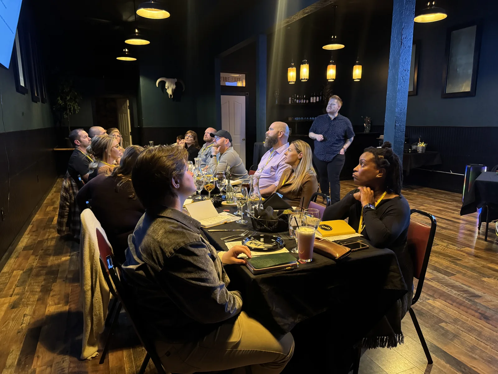Morgan McKell presenting to a room of business owners at a mastermind dinner